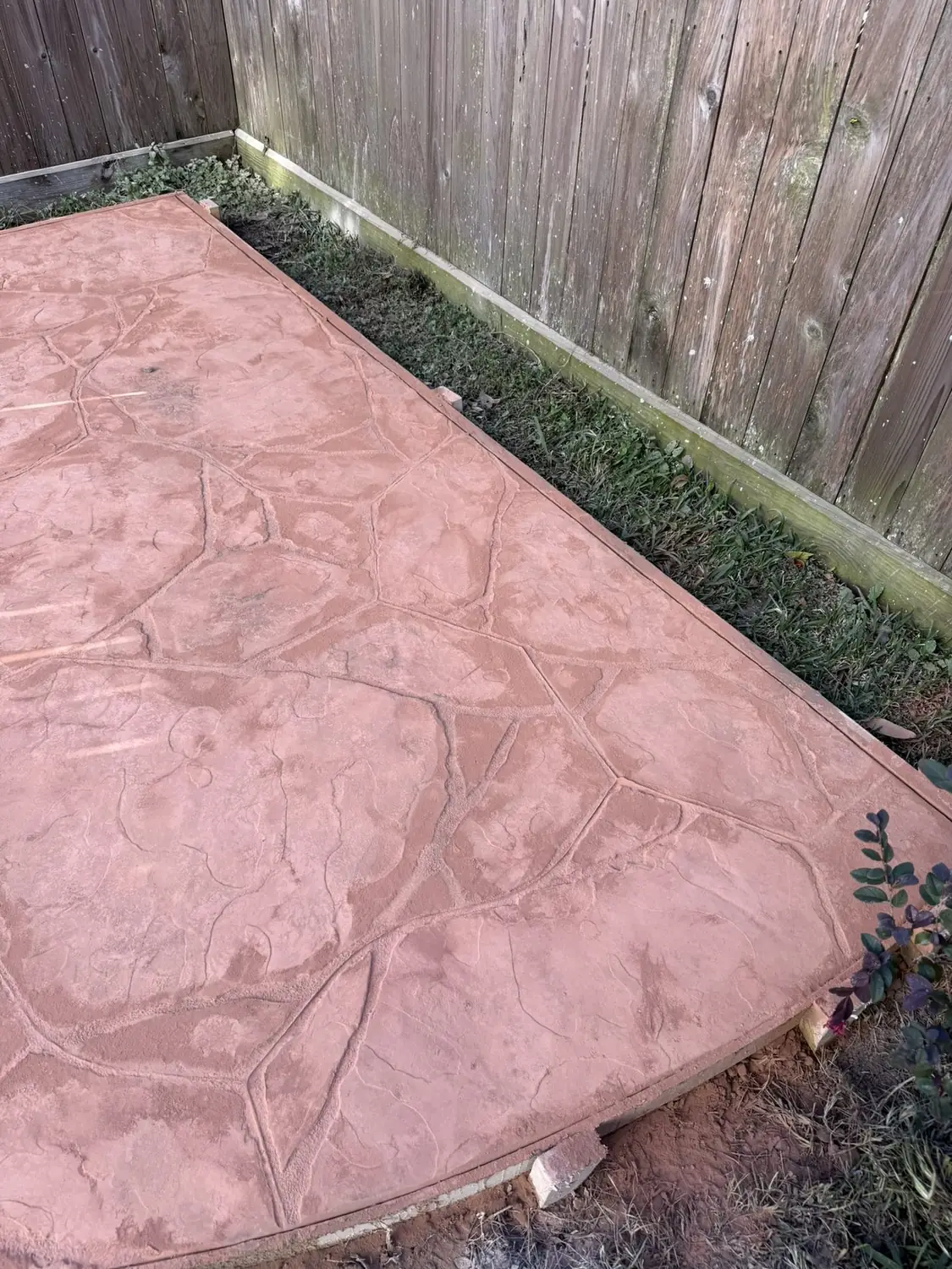 Colored decorative stamped concrete patio with a sealed finish
